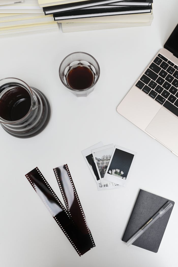 Mastering the First Impression: Your intriguing post title goes here Stylized workspace featuring coffee, laptop, and vintage photography elements for a creative and nostalgic vibe.